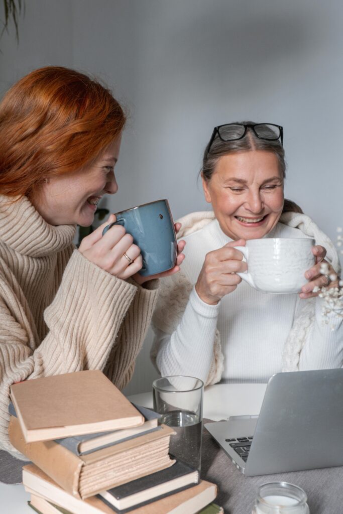 pexels-photo-5486105-5486105 A heartwarming moment of a mother and daughter sharing coffee at home, radiating warmth and togetherness.