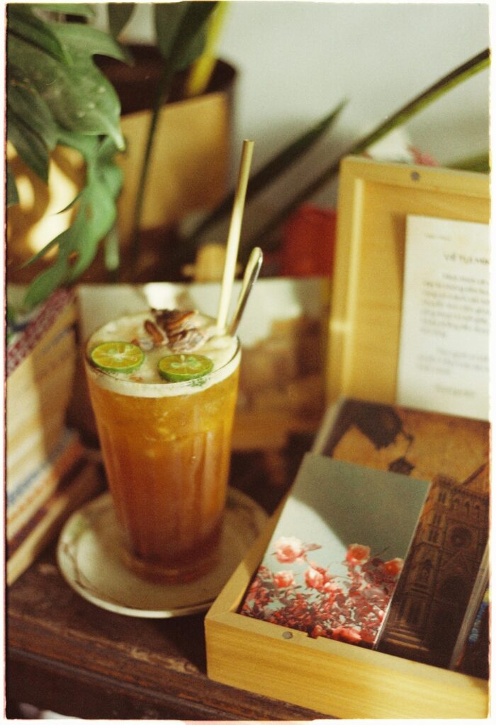 pexels-photo-17614226-17614226 A refreshing iced tea garnished with lime served in a cozy indoor setting with vintage decor.