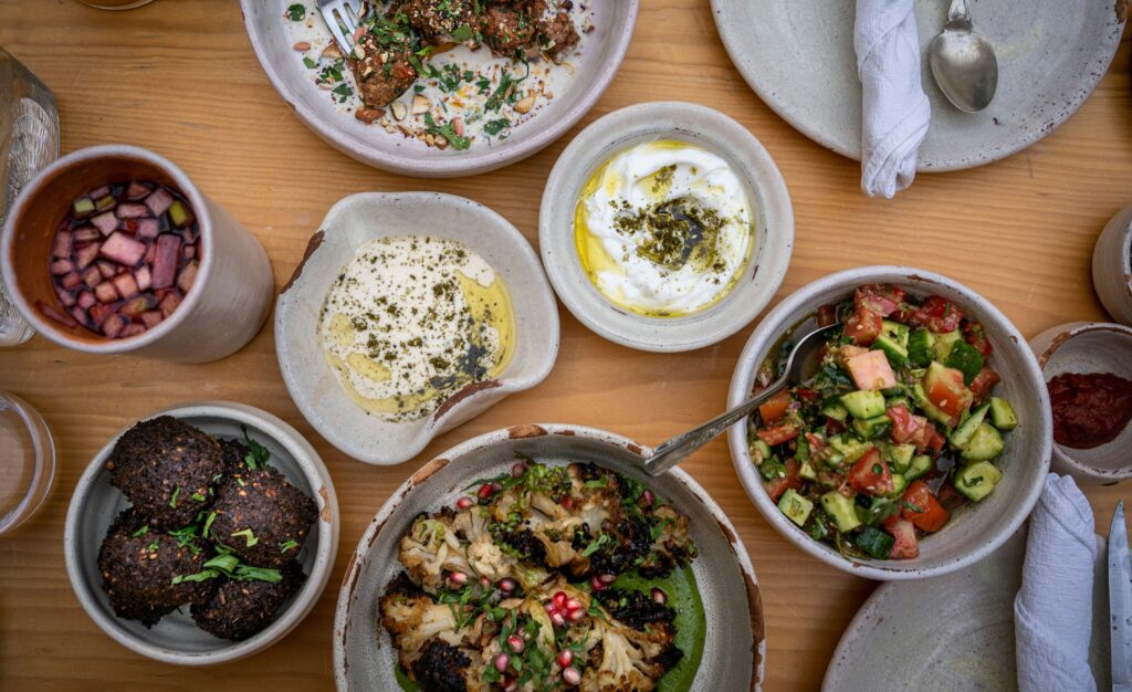 Overhead view of Mediterranean meal spread with fiber-rich foods that support gut health in Parkinson's disease